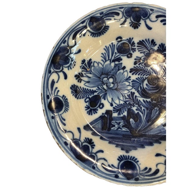This classic cobalt blue on white tin-glazed is the hallmark of Delft pottery. This style was heavily influenced by...