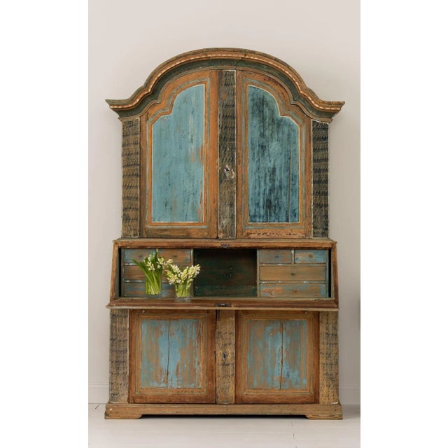 A rare, early 19th century Swedish Rococo style slant-front secretary from Fryksdalen in Värmland with arched cornice,...