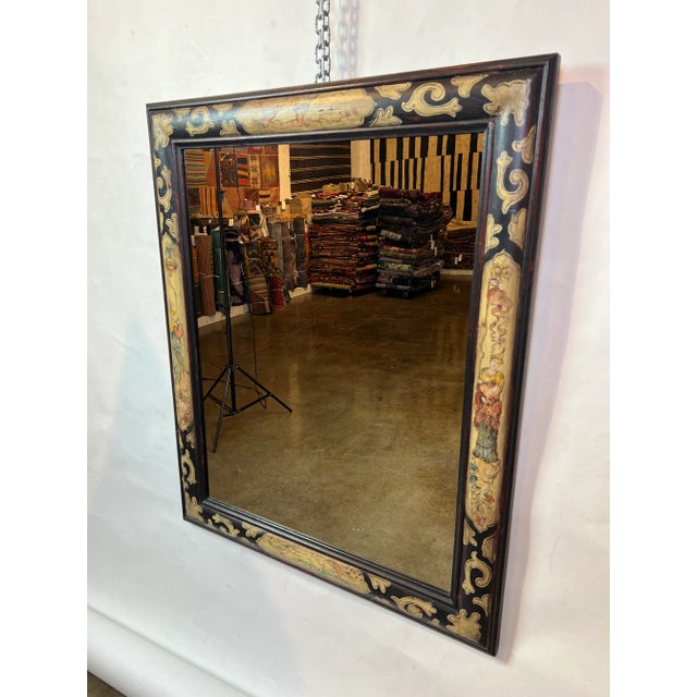 Hand painted, rectangular wooden mirror frame in an oxblood finish with cream-colored accents featuring Chinoiserie...