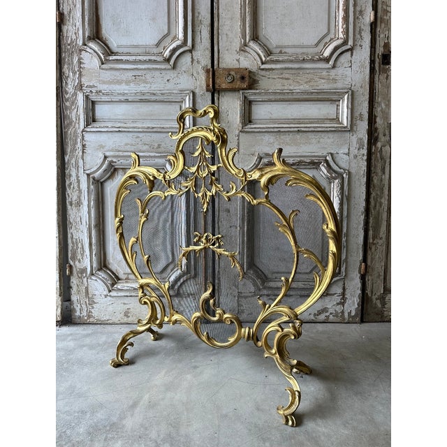 A louis xv rococo style gilt bronze fire screen, circa 1900. Large in size, with remarkable, flowing acanthus leaf...