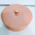 A beautiful round ceramic rose pink with rose gold detail storage jewelry box from 1985. The box is marked on the bottom...