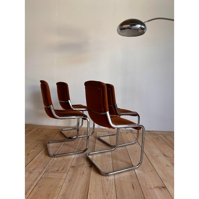 Set of four vintage chairs, Italy, 1950s-1970s. Orange velvet, chrome sled base. Very comfortable, beautiful lines, in the...