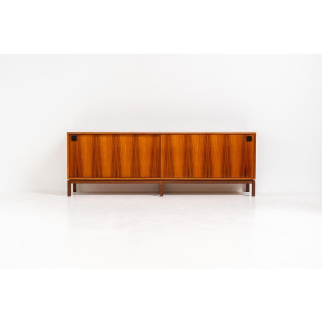 Exceptional XL rosewood sideboard by Alfred Hendrickx for Belform (Belgium, 1960s). This minimalist masterpiece is one of...