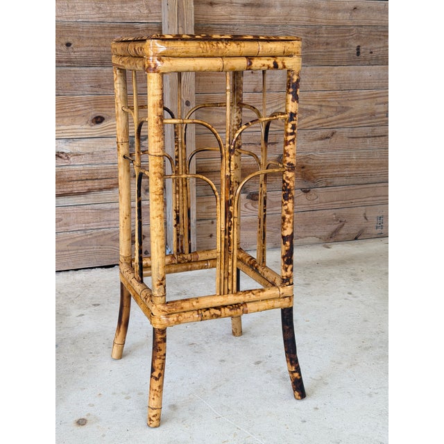 Striking vintage bamboo plant stand featuring beautiful scorched bamboo patterning and decorative Brighton Pavilion–style...