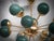 A fantastic green light fixture, with a striking design thanks to the unique shape of these green glass spheres and the...