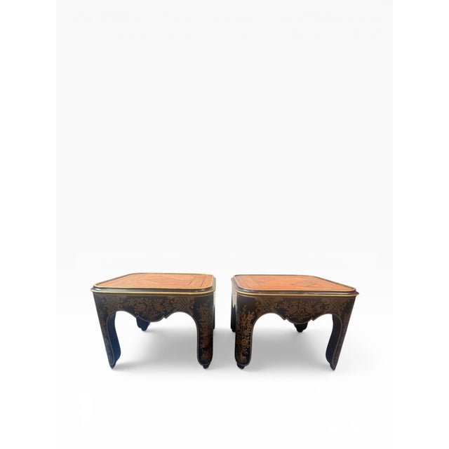 A striking pair of Baker Furniture accent tables showcasing elegant Chinoiserie-inspired design with rich decorative...