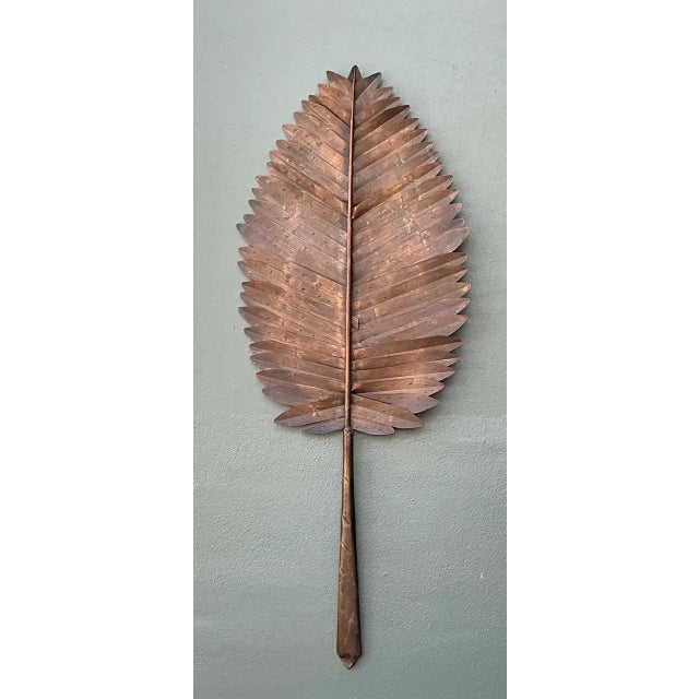 This vintage metal botanical leaf sculpture translates the graceful structure of a natural leaf into a dimensional...