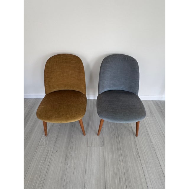 This stylish pair of authentic 1950s mid-century modern accent chairs features clean lines, tailored upholstery, and...