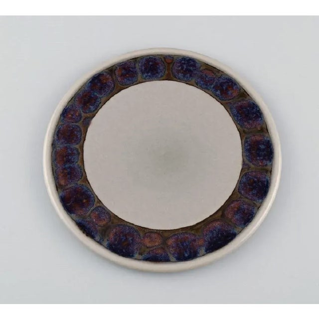 Twelve Bing & Grøndahl Mexico butter boards in glazed stoneware. Model number 950. Danish design, 1970s / 1980s. Diameter:...