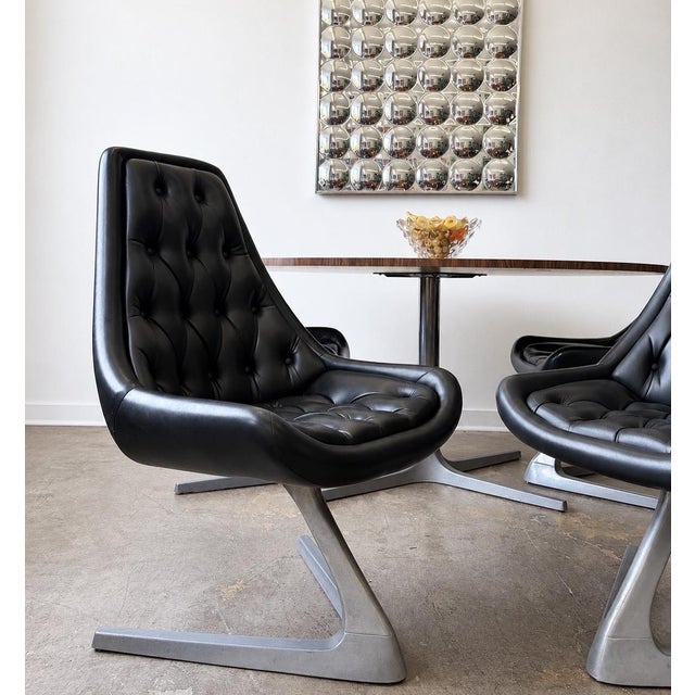 An incredible original 1960s Space Age dining set by Chromcraft, featuring four iconic Sculpta swivel chairs paired with...