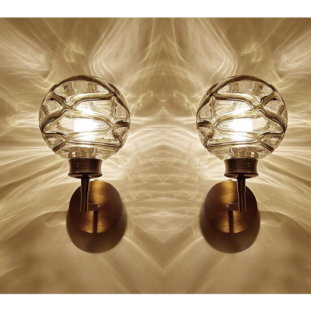 Pair of Vintage sconces by Doria 1970s, brass structure with structured cocoon Murano glass globes with dark sage green...