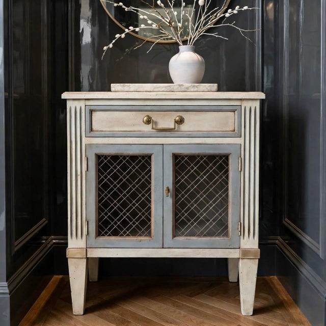 A masterclass in European decorative arts, this rare mid-century Henredon Fine Furniture commode has been masterfully...