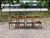 Elegant Mid-Century dining chair crafted from solid teak with a beautifully oiled finish. The seat is upholstered in black...