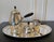 A Danish sterling silver four-piece coffee or tea set by Georg Jensen. This lovely set consists of a coffeepot, lidded...
