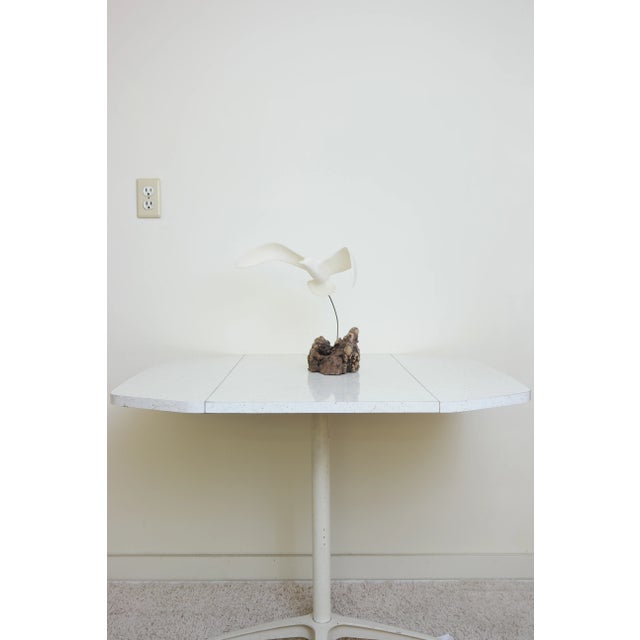 Resin and wood table top sculpture, in the form of an abstract seagull. Good overall condition for it's age, showing some...