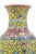 A vintage Chinese porcelain vase featuring a classic baluster form and an intricate allover floral motif. The surface is...