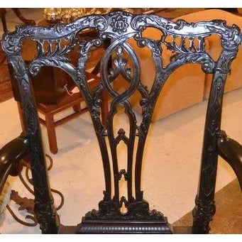 Pair of fine oversize 19th c. English carved mahogany arm chairs, with original needlepoint pair 40"H 26"W 17 1/2"H (seat)