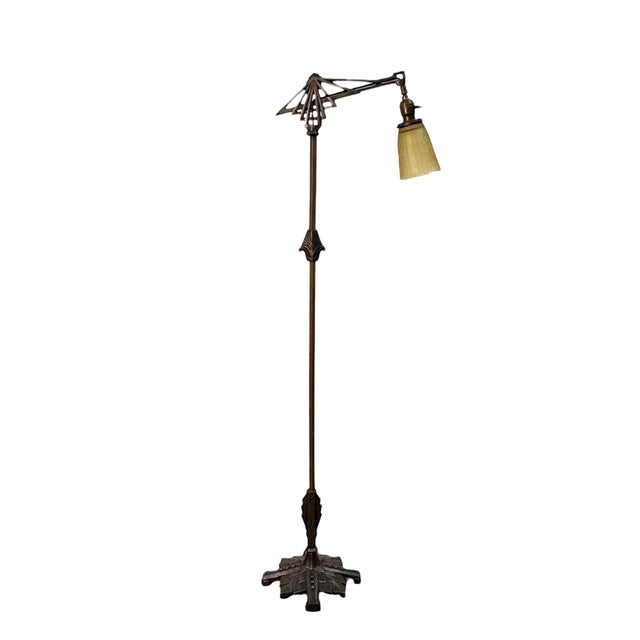 Made in cast iron an brass, this art deco lamp has an amber glass shade and paddle on/off switch. Excellent art deco or...
