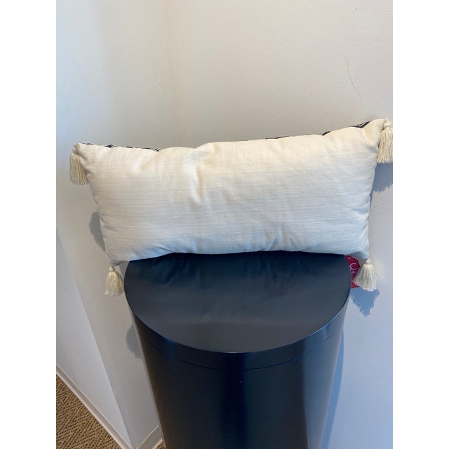 Elevate your interior design with this striking lumbar pillow, a perfect blend of modern geometric style and artisanal...