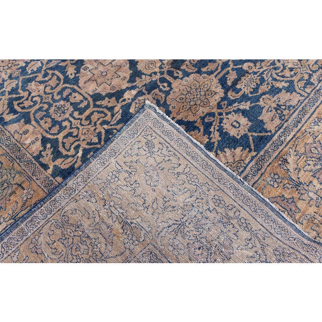 Among the finest of the antique rugs in our collection, the present example ahs a dark blue field beneath a curvilinear...