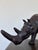 This large leather rhinoceros statue is a handcrafted piece with detailed workmanship. It features a naturalistic form...