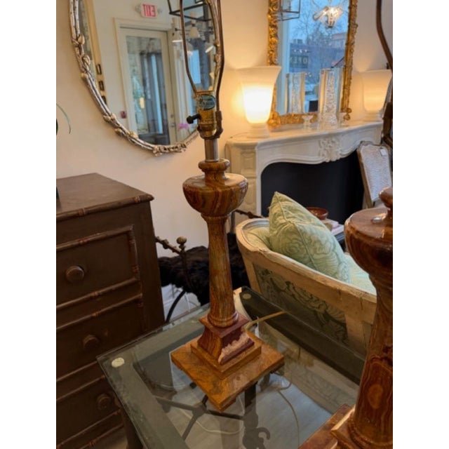 This is a pair of vintage onyx lamps in an urn column like shape. They are in excellent condition, heavily weighted with...