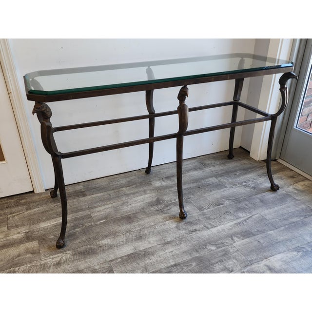 Enhance your living space with this striking vintage Hollywood Regency console table. Masterfully crafted from patinated...