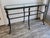 Enhance your living space with this striking vintage Hollywood Regency console table. Masterfully crafted from patinated...