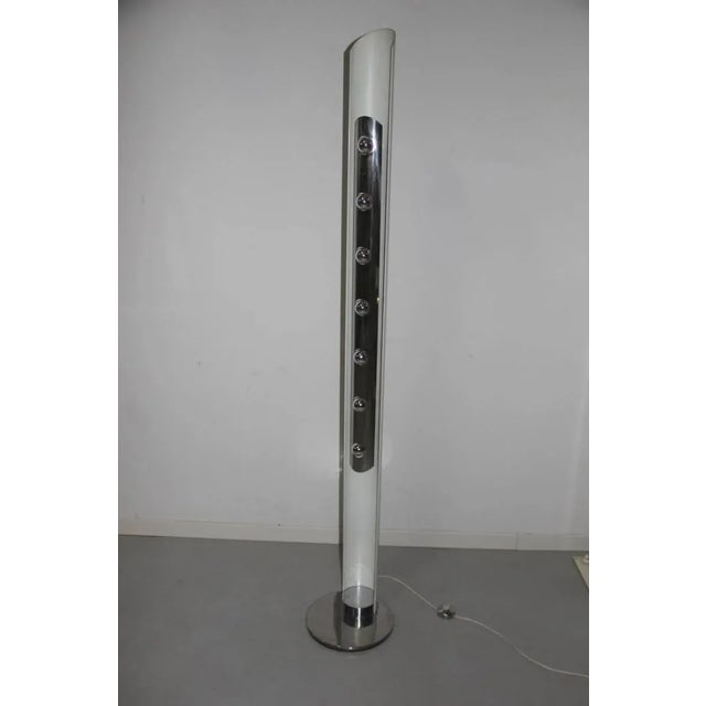 This sculptural floor lamp by Enrico Tronconi dates to the 1970s. Up to 250V (Europe/UK Standard).The wiring of this item...