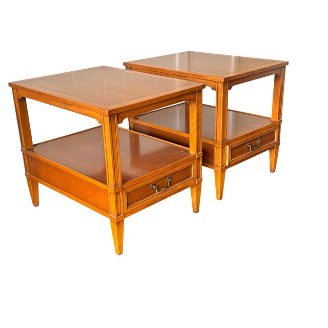 A handsome pair of Hekman mid century modern walnut end tables, dating to the 1960s, showcasing the clean lines,...