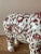 This remarkable vintage rhinoceros sculpture is a whimsical blend of classic Chinoiserie artistry and bohemian flair....
