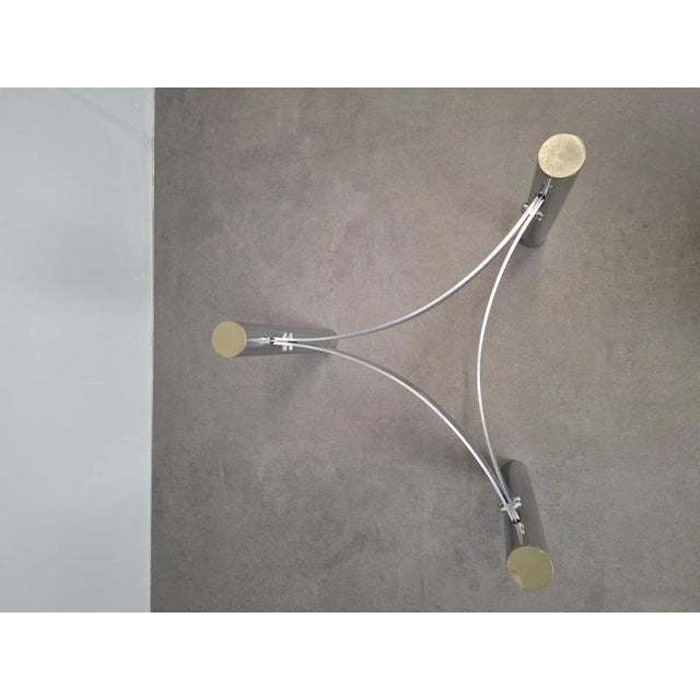 This Midcentury modern coffee table was produced in Czechoslovakia during the 1970s. It features a round smoked glass top...