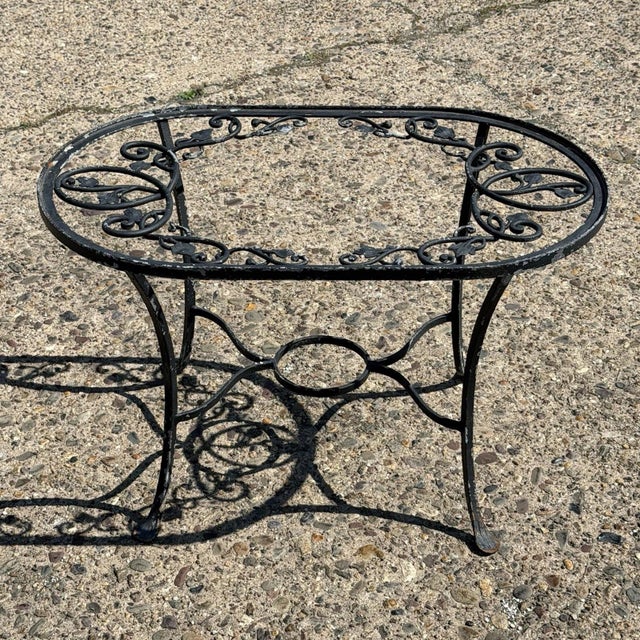 Vintage Salterini Style Leaf & Vine Scrolling Wrought Iron Small Oval Garden Patio Coffee Table (no glass). Circa Mid 20th...
