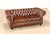 High Quality Tufted Brown Leather Chesterfield Sofa with Rolled Arms, Brass Nailhead Trim, and Turned Feet