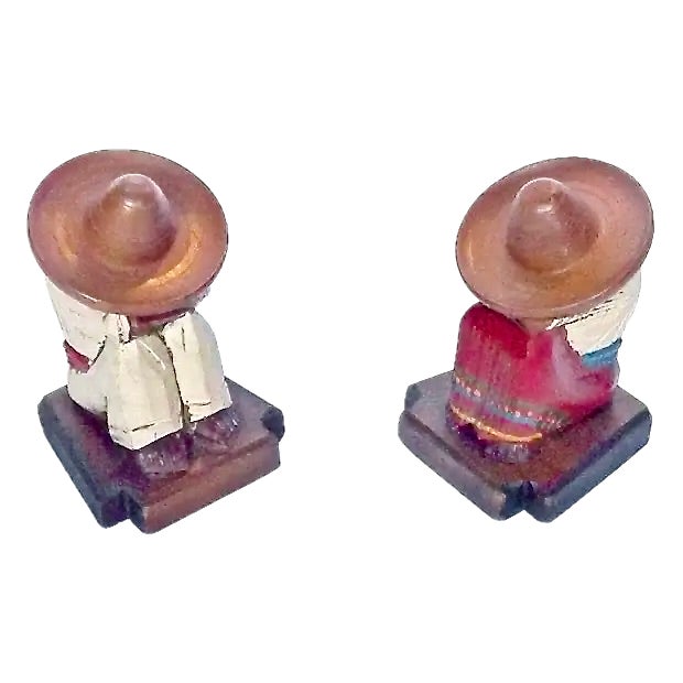 Pair of Vintage 1960s Mexican Charros having a siesta candleholder bookends with hinged sombreros. Depicts hand-carved and...