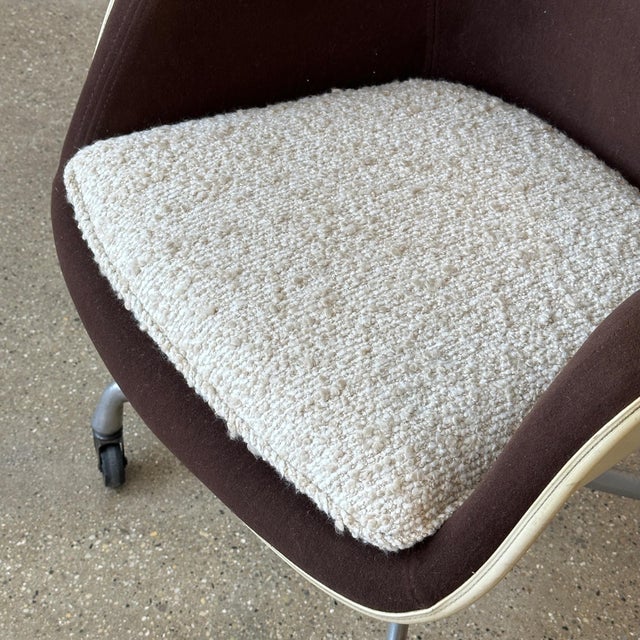 c. 1979. We reupholstered and refoamed the loose cushion in a nubby brown/white boucle but kept the chair fabric original.