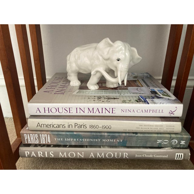 An adorably mid 20th century porcelain elephant figurine. Stunning details, sure to make a statement to any room.