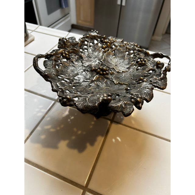 Late 19th/Early 20th Century, possibly European, or USA. Heavy metal decorative compote featuring grapes and leaves. Often...