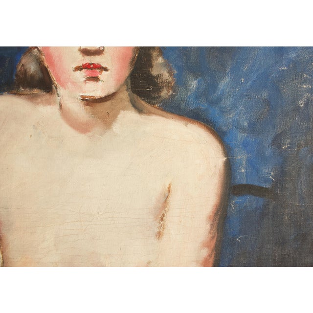 A truly striking wood framed painting of a partially nude woman. The subject's alabaster skin and rosy cheeks contrast...