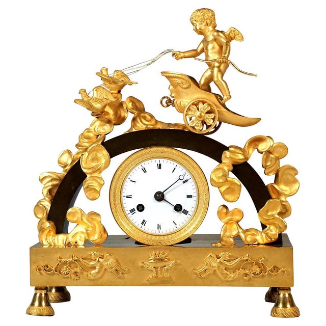 Exquisite mantel clock made of fire-gilded and patinated bronze from the early 19th century: Structure in the form of a...