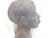 This sculpted bust of a woman is an unglazed, fired ceramic.