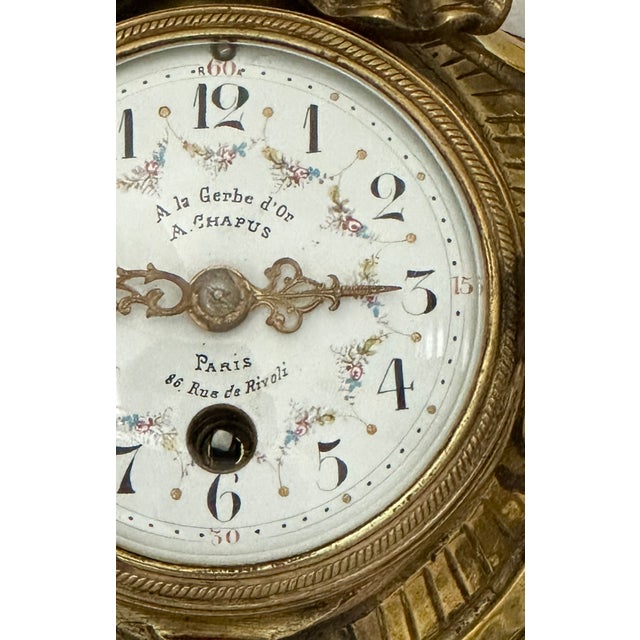 A « Belle Époque » cartel clock of refined Parisian character, signed by A. CHAPUS " À la Gerbe d'Or " at the address 86...