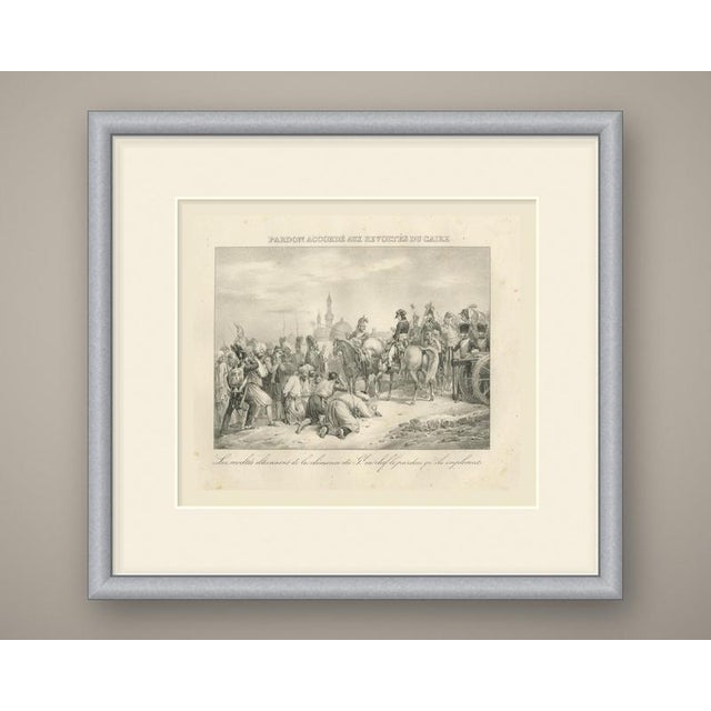 An original antique lithograph from madou's vie de napoléon, published at brussels in 1827, lettered "pardon accordé aux...