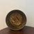 Decorative 1980s vintage brass cachepot or jardinière featuring a rounded form, three ornate feet and handsome gadrooned...