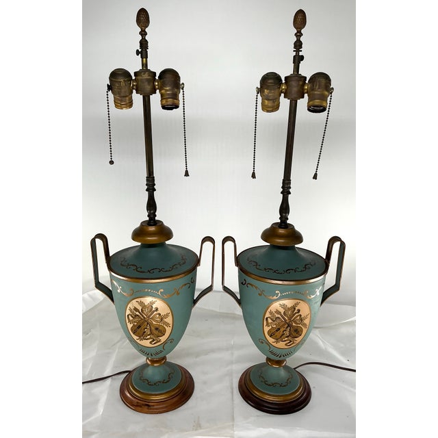 Beautiful pair of 19th century tole users made into lamps. Blue-green color with music theme hand painted details in...