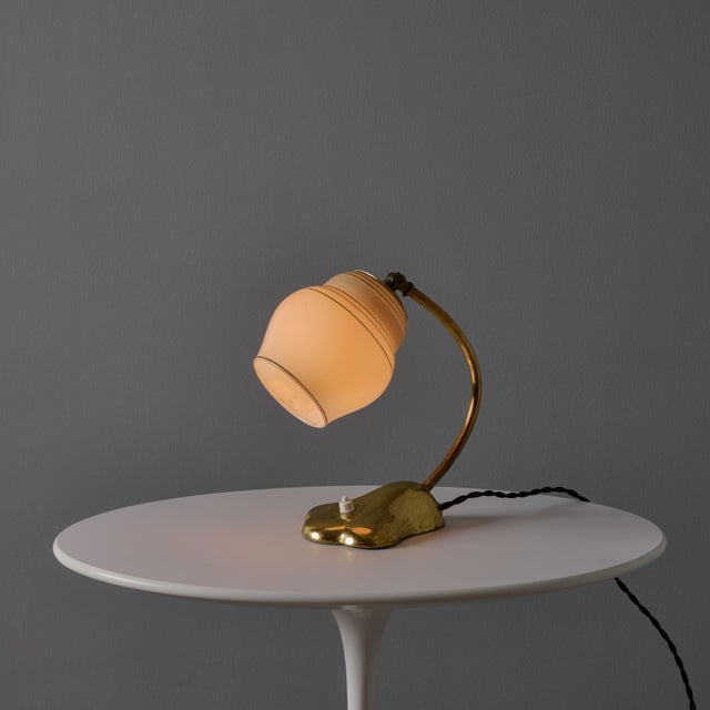 1950s Sculptural Glass and Brass Table Lamp in the Manner of Paavo Tynell for Valinte Oy Executed in an opaline glass...