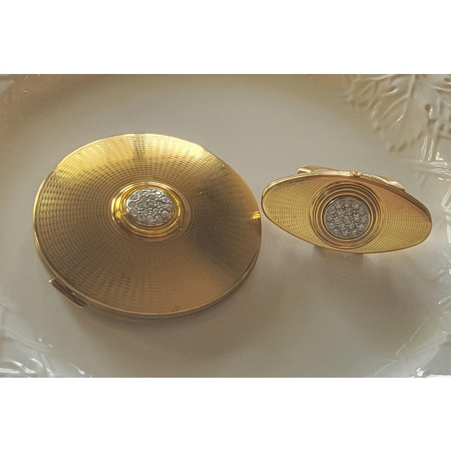 A beautifully preserved Stratton of London vanity set, featuring a powder compact and matching lipstick holder, both...