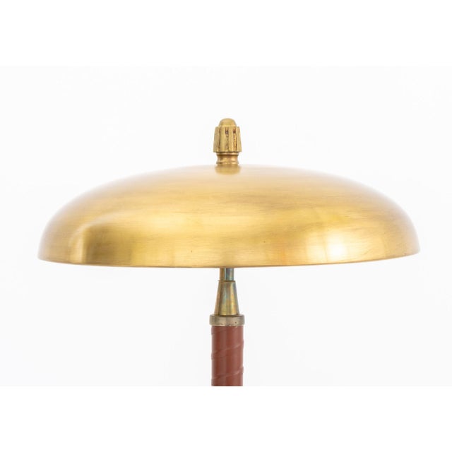 Einar Backstrom Model 5013 Brass and Leather Wrapped Table Lamp, circa 1945, marked to underside. 20" H x 13.75" Diameter....