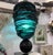 Table lamp consisting of a square, black Murano glass base with a brass finial. A central stem has been added to this...