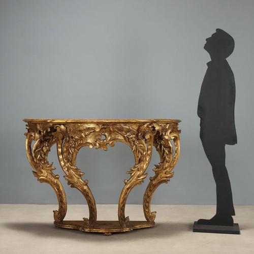 Eclectic console in carved and gilded fir wood, representative of the elegance and craftsmanship of the 19th century in...